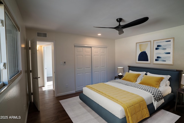 bedroom featuring visible vents, dark wood finished floors, baseboards, a closet, and recessed lighting