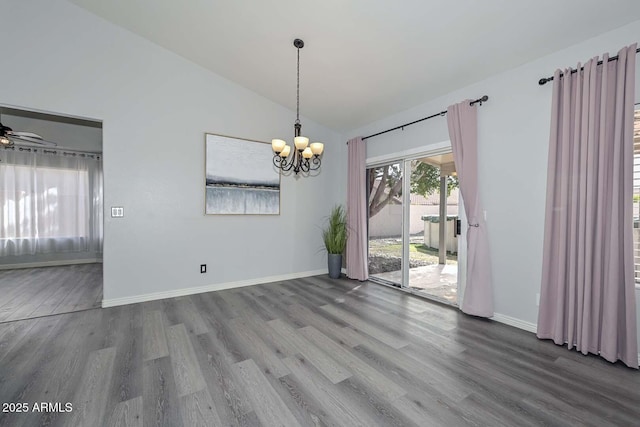 unfurnished dining area with hardwood / wood-style flooring, ceiling fan with notable chandelier, and lofted ceiling