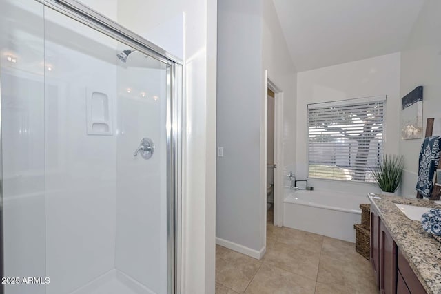 full bathroom with tile patterned floors, vanity, toilet, and plus walk in shower