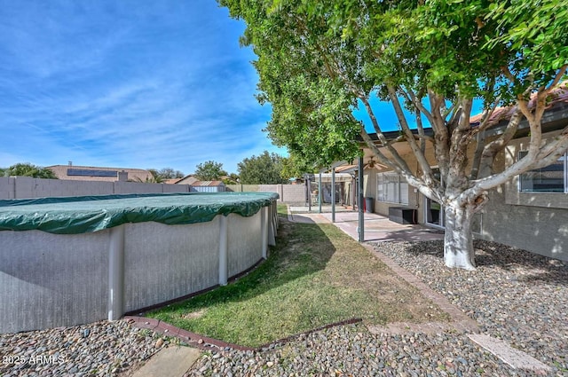 view of yard featuring a covered pool