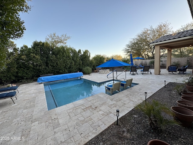 view of swimming pool with a patio