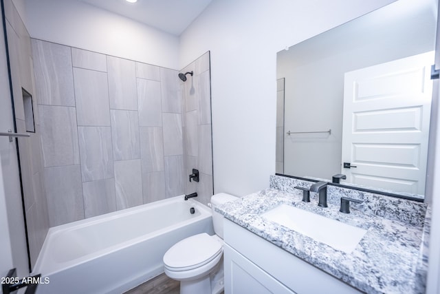 full bathroom with vanity, toilet, and tiled shower / bath