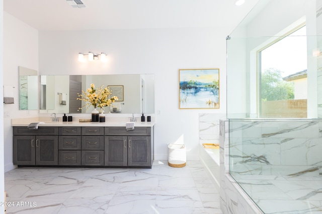 bathroom featuring double vanity, tile flooring, and separate shower and tub