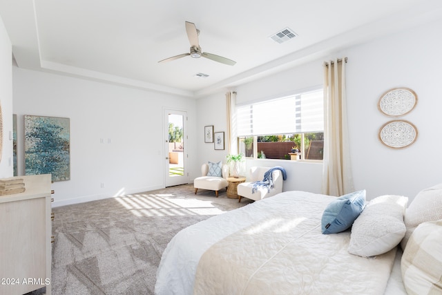 bedroom featuring ceiling fan, access to exterior, and light colored carpet