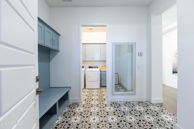 interior space with washer and dryer and tile floors