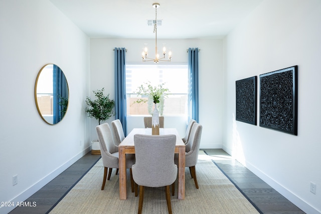 dining space featuring hardwood / wood-style floors, a chandelier, and a wealth of natural light