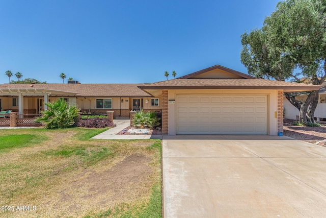 10236 N 105th Dr, Sun City, AZ 85351 - ranch-style home with driveway, a front yard, an attached garage, and brick siding