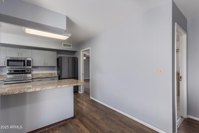 10236 N 105th Dr, Sun City, AZ 85351 - kitchen featuring appliances with stainless steel finishes, gray cabinets, baseboards, and dark wood-style floors