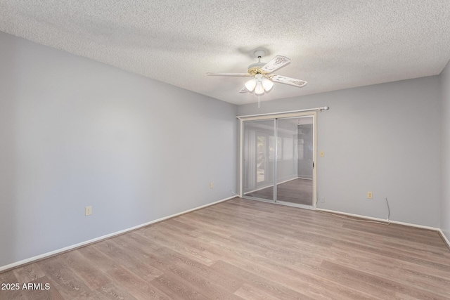 10236 N 105th Dr, Sun City, AZ 85351 - empty room with ceiling fan, light wood finished floors, a textured ceiling, and baseboards