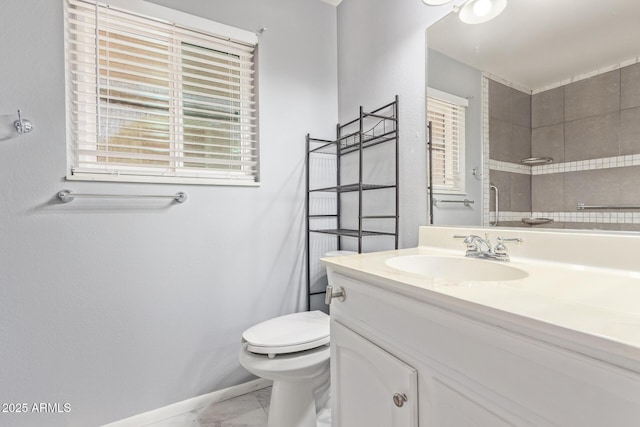 10236 N 105th Dr, Sun City, AZ 85351 - full bath with marble finish flooring, toilet, vanity, and healthy amount of natural light