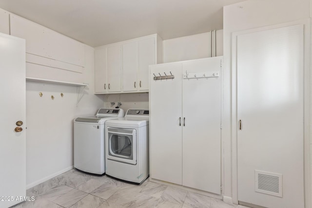 10236 N 105th Dr, Sun City, AZ 85351 - laundry room with cabinet space, independent washer and dryer, light marble finish flooring, and baseboards