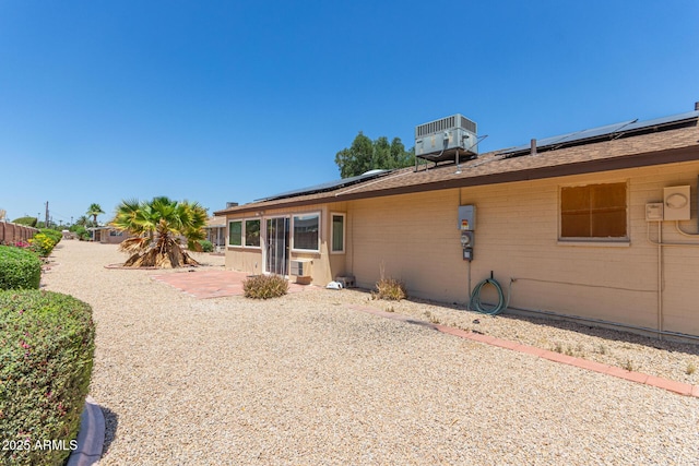 10236 N 105th Dr, Sun City, AZ 85351 - back of property featuring solar panels, central AC, and a patio area
