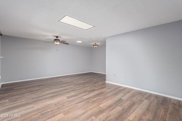 10236 N 105th Dr, Sun City, AZ 85351 - unfurnished room featuring baseboards, wood finished floors, and a ceiling fan