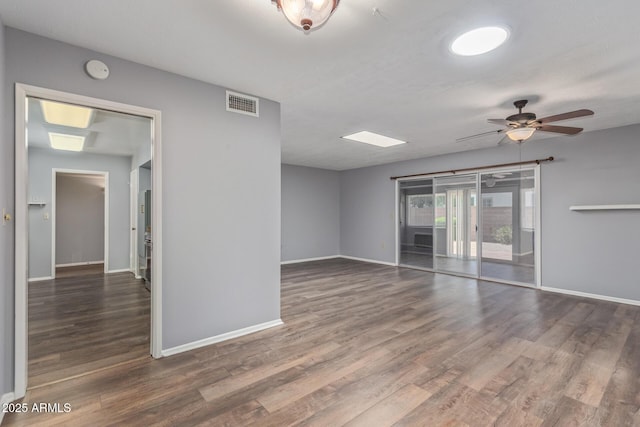 10236 N 105th Dr, Sun City, AZ 85351 - spare room with baseboards, wood finished floors, a smoke detector, and a ceiling fan