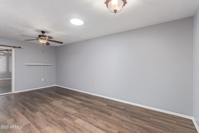10236 N 105th Dr, Sun City, AZ 85351 - unfurnished living room with a ceiling fan, baseboards, and wood finished floors