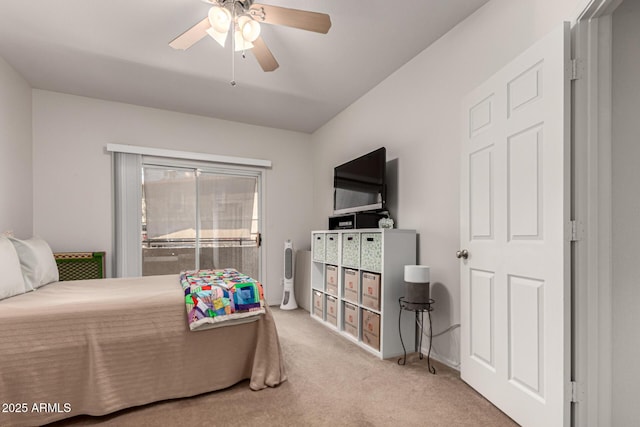 bedroom with a ceiling fan and carpet