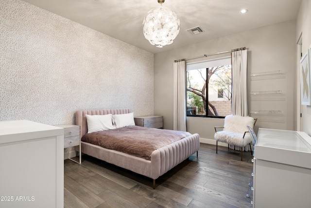 bedroom with visible vents, wallpapered walls, a chandelier, recessed lighting, and hardwood / wood-style flooring