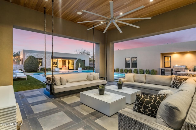 view of patio / terrace with an outdoor pool, an outdoor hangout area, and a grill