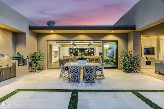 view of patio featuring grilling area and outdoor dining area