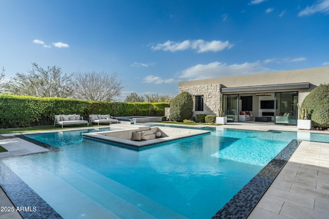 view of swimming pool featuring a patio, fence, a fenced in pool, and an outdoor living space