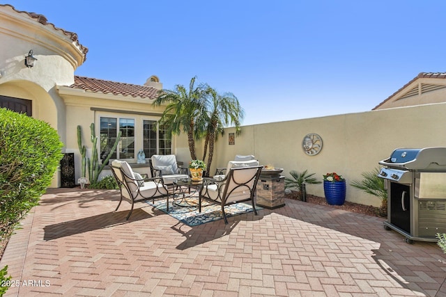 view of patio with a grill