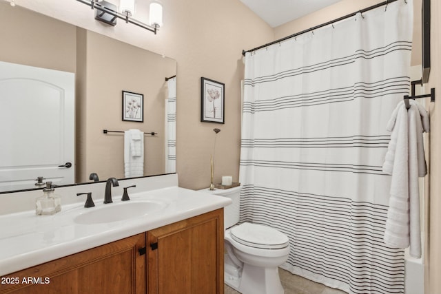 full bathroom with tile patterned flooring, toilet, and vanity