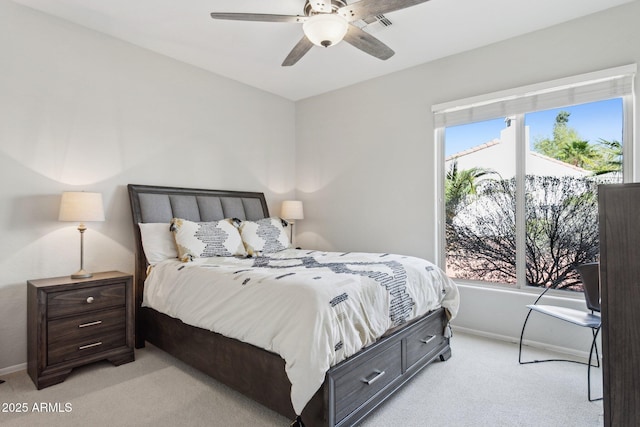 bedroom with baseboards, light carpet, and a ceiling fan