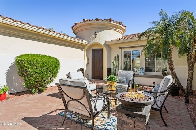 view of patio with an outdoor fire pit