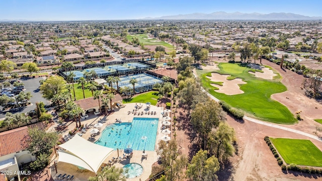 birds eye view of property featuring view of golf course, a mountain view, and a residential view