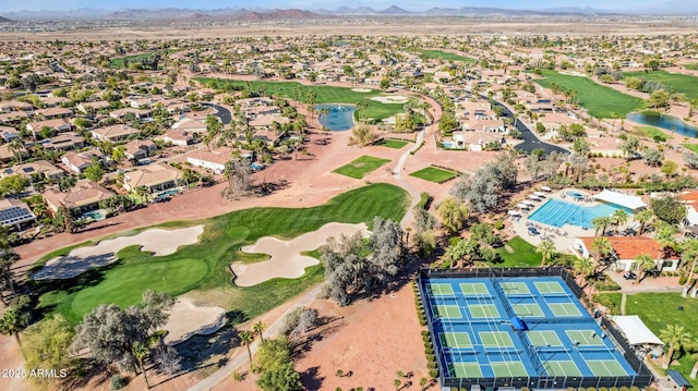 aerial view featuring a mountain view, golf course view, and a residential view