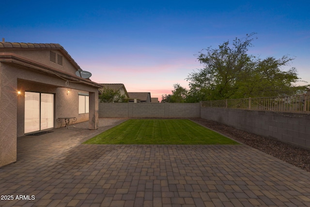 exterior space with a patio area and a fenced backyard