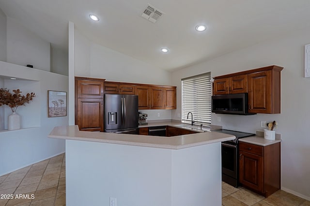 kitchen featuring range with electric stovetop, stainless steel fridge with ice dispenser, sink, and a kitchen island