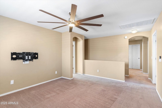 empty room with light colored carpet and ceiling fan