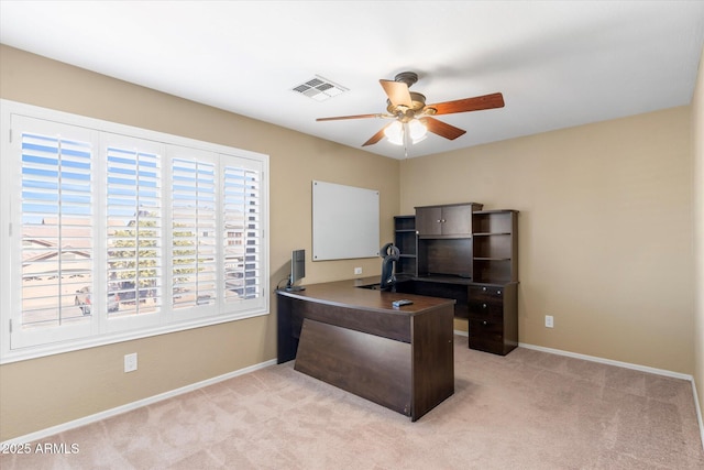 home office with ceiling fan and light colored carpet