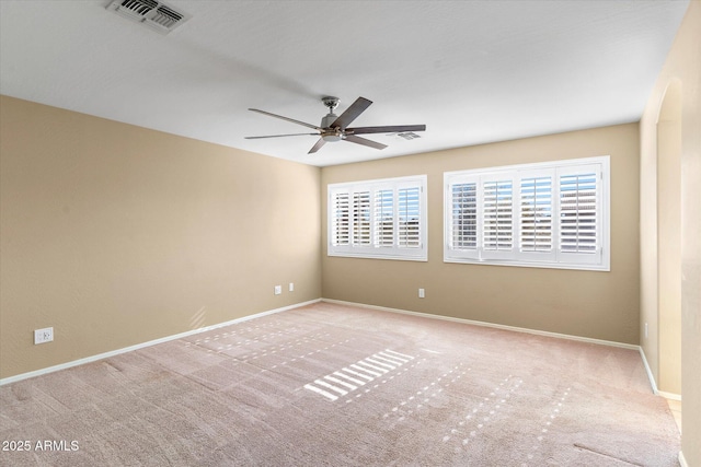 carpeted empty room with ceiling fan