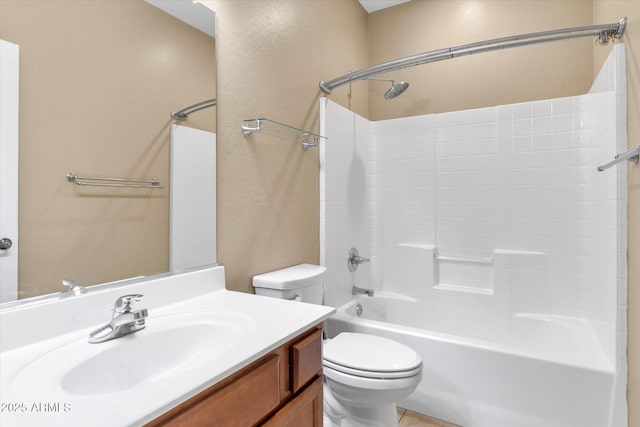 full bathroom featuring vanity, bathing tub / shower combination, and toilet