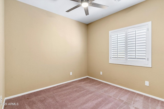 carpeted empty room with ceiling fan