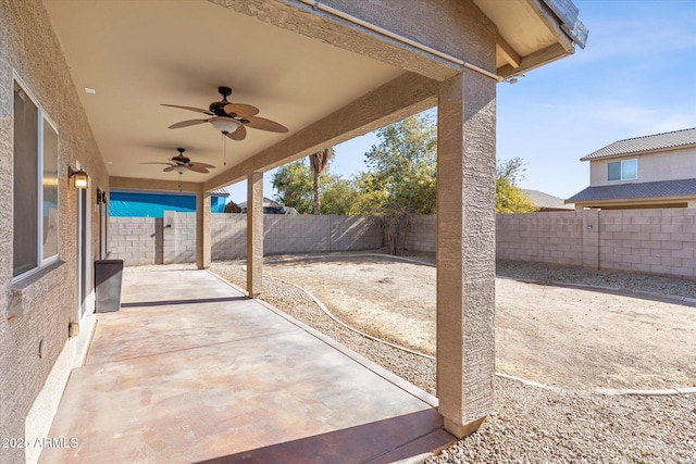 view of patio featuring ceiling fan