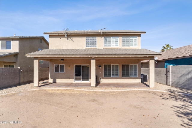 back of house with central AC unit, ceiling fan, and a patio area