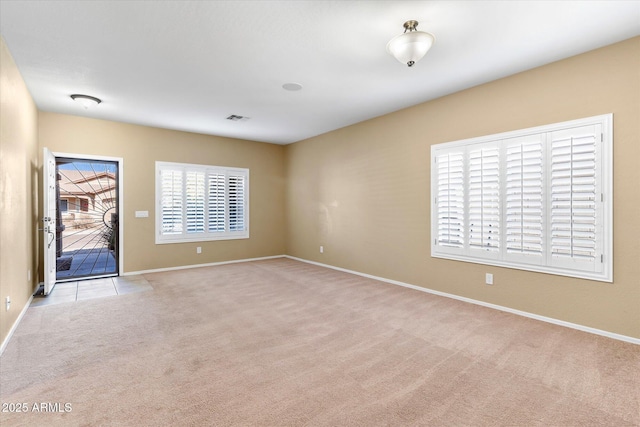 empty room featuring light colored carpet