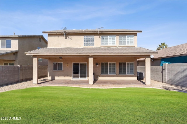 rear view of property with ceiling fan, a patio, central AC unit, and a lawn