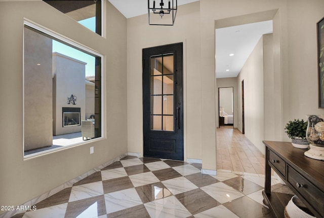 29067 N 71st Ave, Peoria, AZ 85383 - foyer entrance featuring a chandelier and baseboards