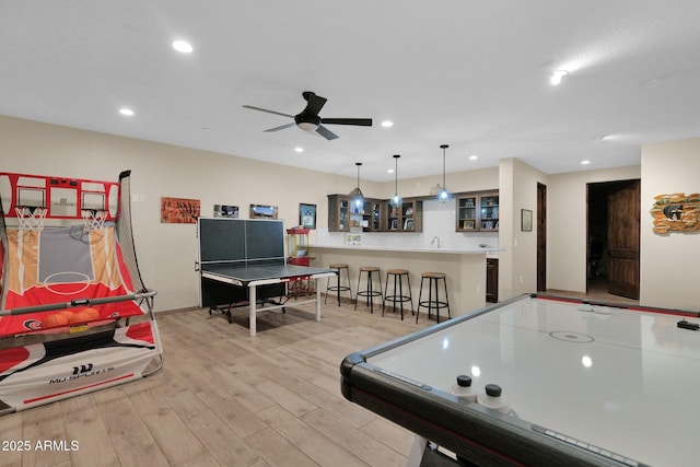 29067 N 71st Ave, Peoria, AZ 85383 - recreation room featuring light wood-type flooring, wet bar, ceiling fan, and recessed lighting