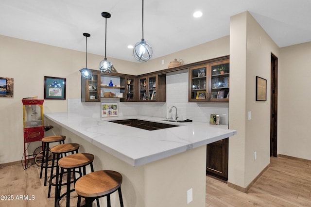 29067 N 71st Ave, Peoria, AZ 85383 - bar area featuring backsplash, light wood-type flooring, pendant lighting, and recessed lighting