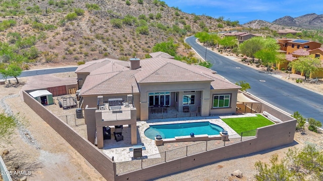 29067 N 71st Ave, Peoria, AZ 85383 - view of swimming pool with a mountain view, a fenced backyard, a patio, and a hot tub