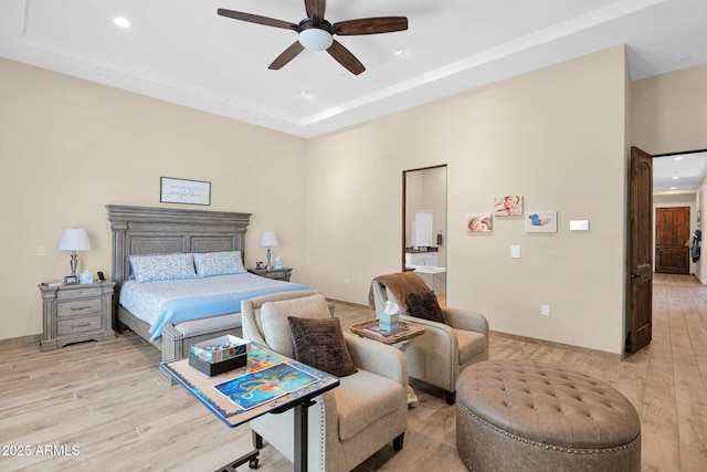 29067 N 71st Ave, Peoria, AZ 85383 - bedroom with light wood-type flooring, recessed lighting, a raised ceiling, and ceiling fan