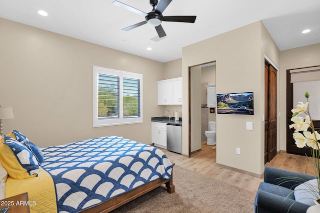 29067 N 71st Ave, Peoria, AZ 85383 - bedroom with light wood-style floors, refrigerator, ensuite bath, recessed lighting, and a ceiling fan