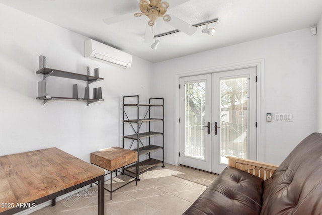 entryway with ceiling fan, a wall mounted AC, track lighting, light tile patterned floors, and french doors