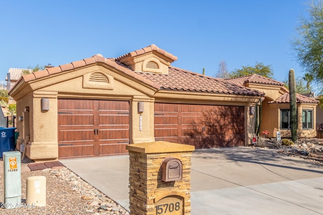 mediterranean / spanish-style house featuring a garage