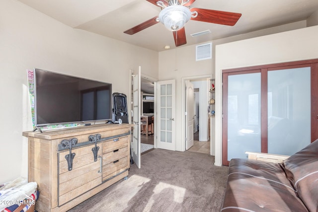 carpeted bedroom featuring ceiling fan and french doors